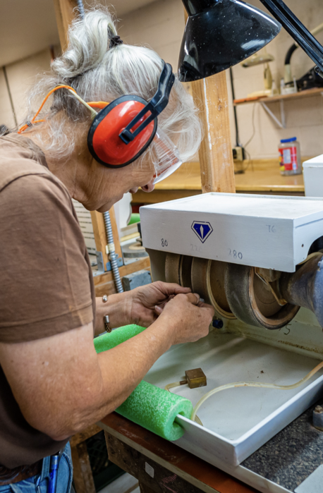 OGMS member Gail Sanford at the wheel shaping a stone